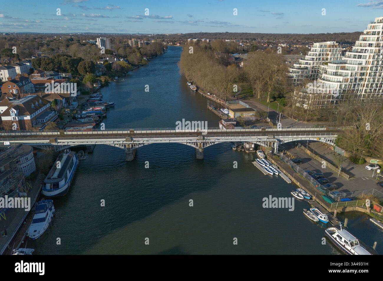 Aerial view of a train crossing the Kingston Railway Bridge, (KT1), Kingston, Surrey, UK. Stock Photo