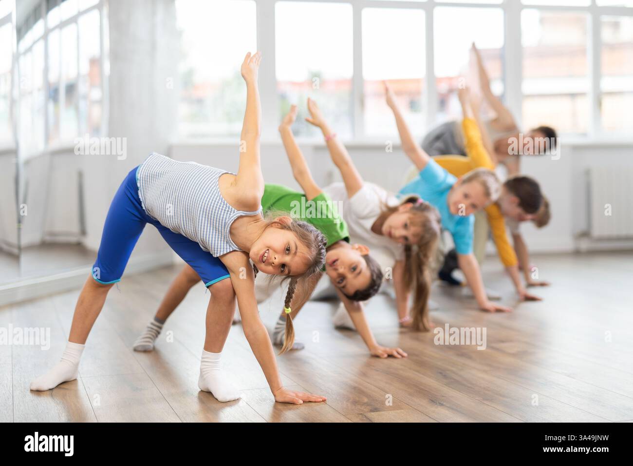 Group of children warming up before dance class Stock Photo