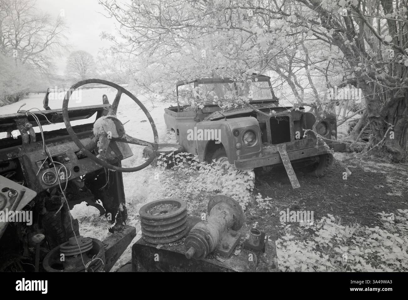 Abandoned Land Rover Defenders in a field, Infrared photography Stock ...