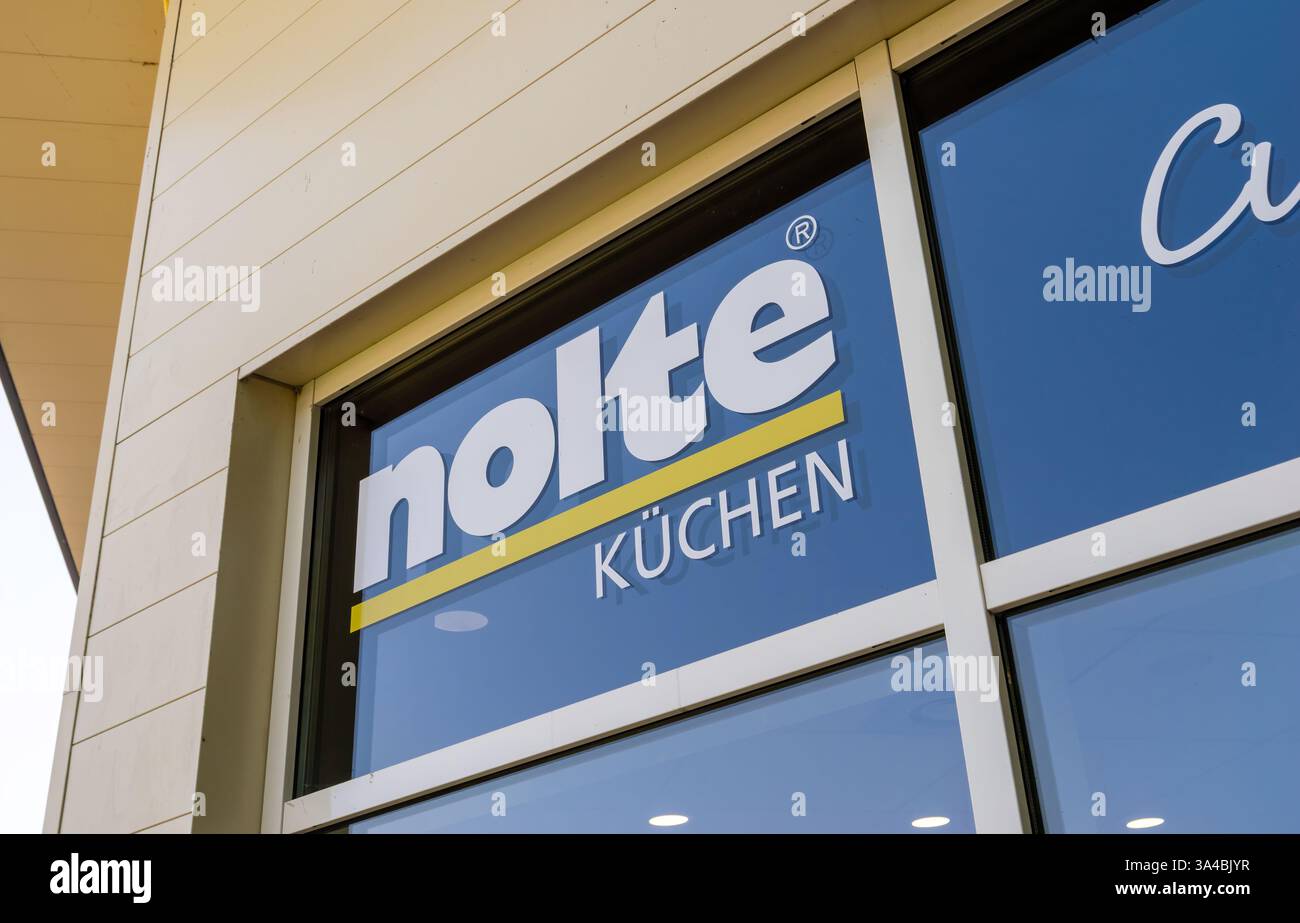Le Touquet, France - Aug 23, 2023: Close-up of the Nolte Kuchen store signage on the facade, featuring the brand s name in bold blue and yellow colors Stock Photo