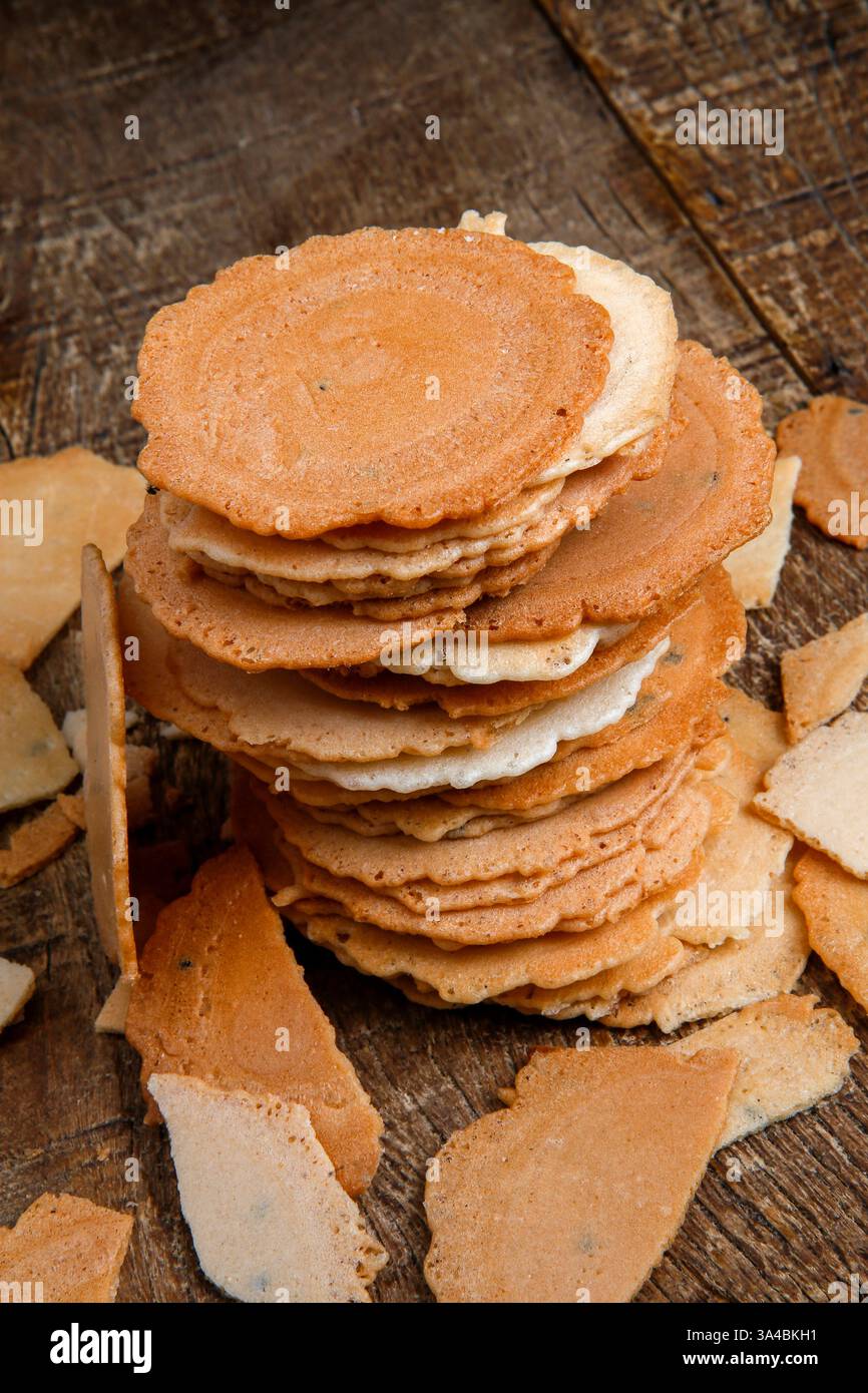 Japanese baked rice snack named Senbei on wood background Stock Photo