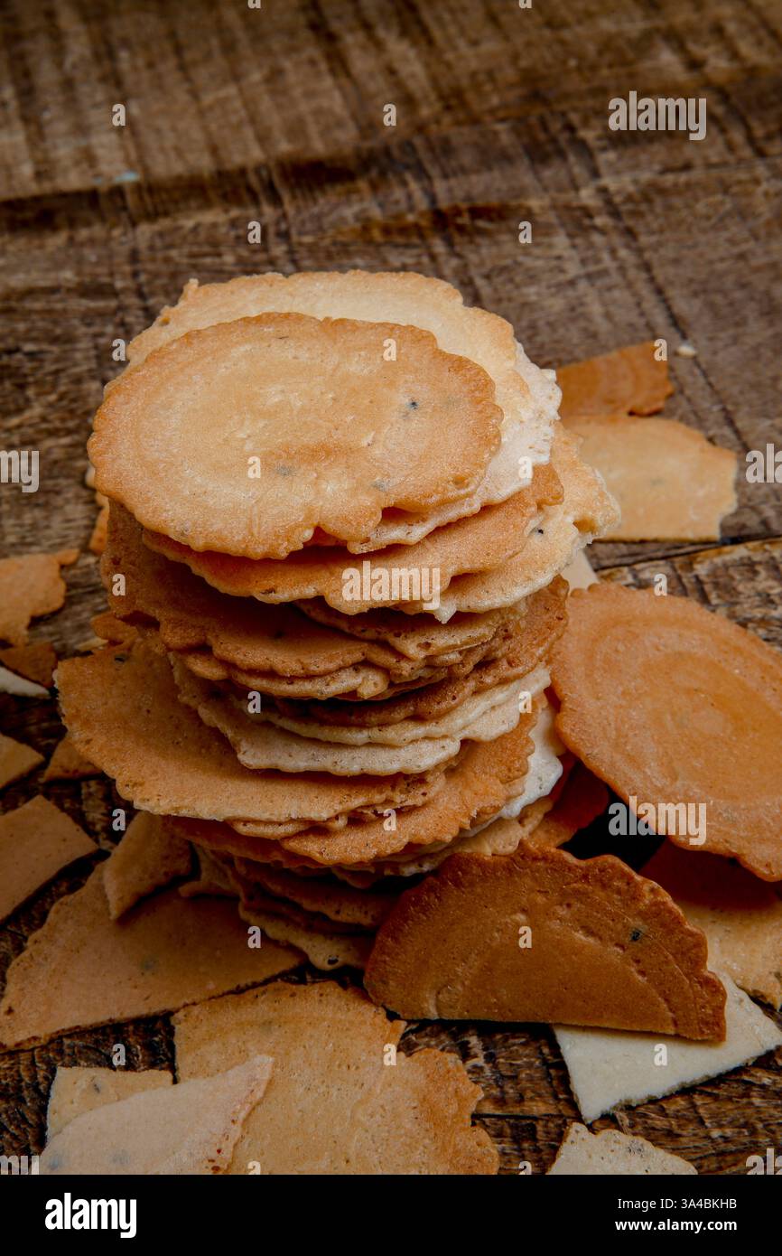 Japanese baked rice snack named Senbei on wood background Stock Photo