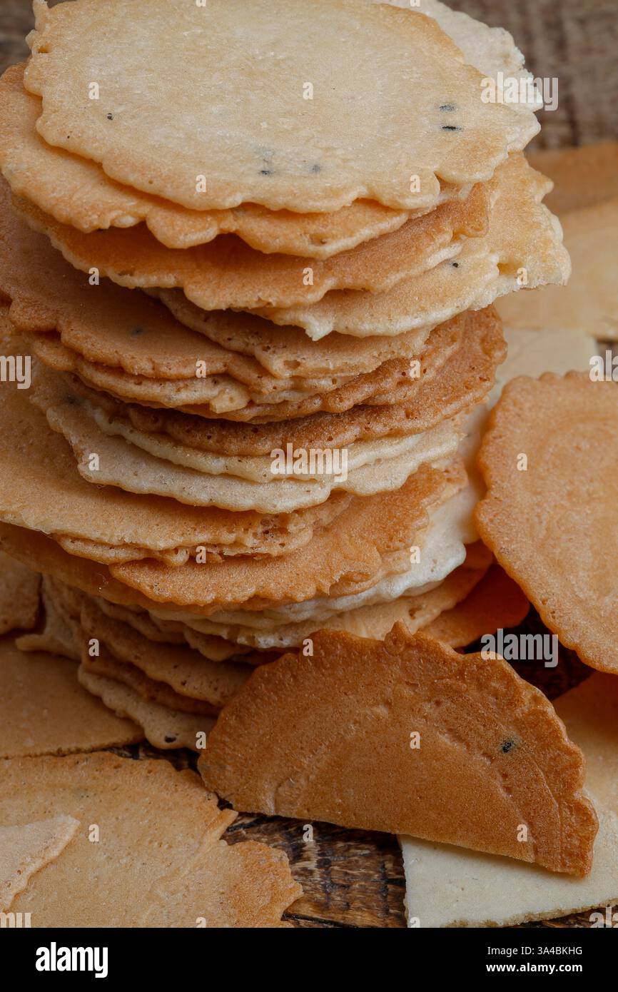 Japanese baked rice snack named Senbei on wood background Stock Photo