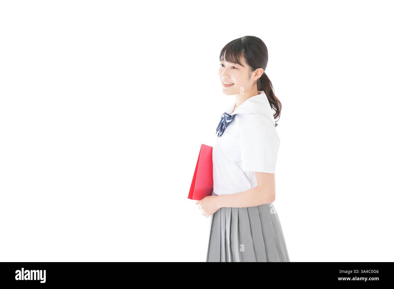 Smiling schoolgirl in uniform Stock Photo - Alamy