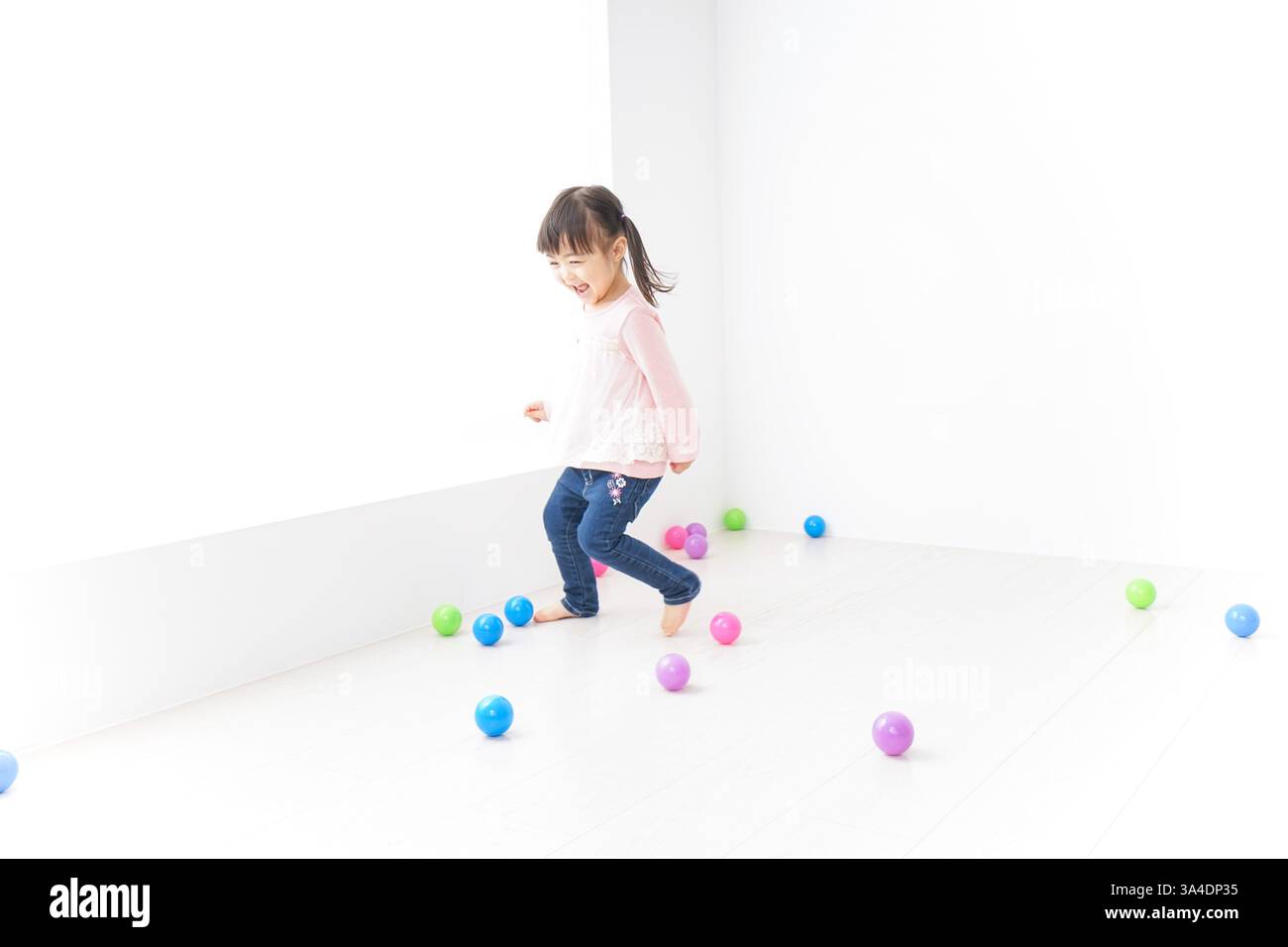 Child playing with dog Stock Photo