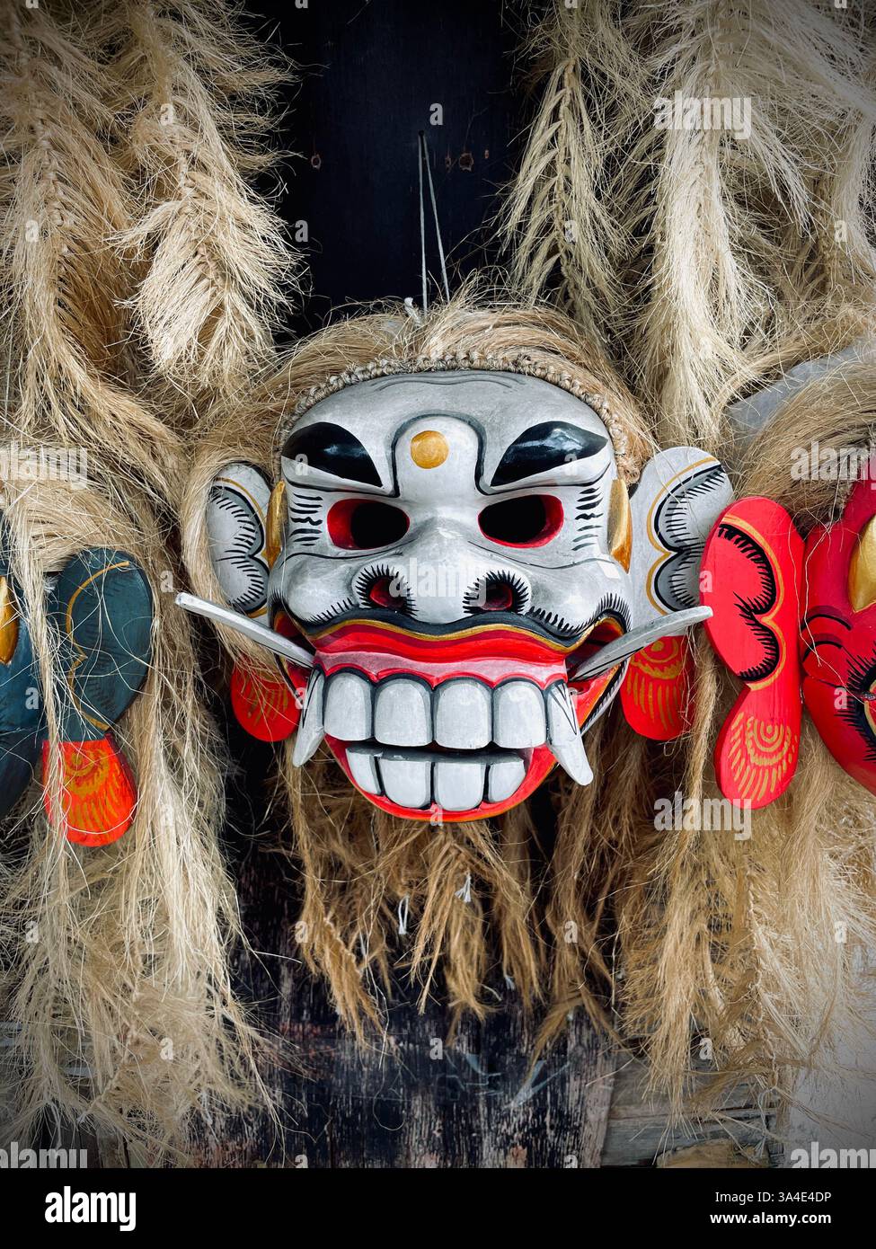 Traditional Balinese mask in a souvenir shop. Mask for masquerade or theater in Indonesia - Smartphone Captured Stock Image