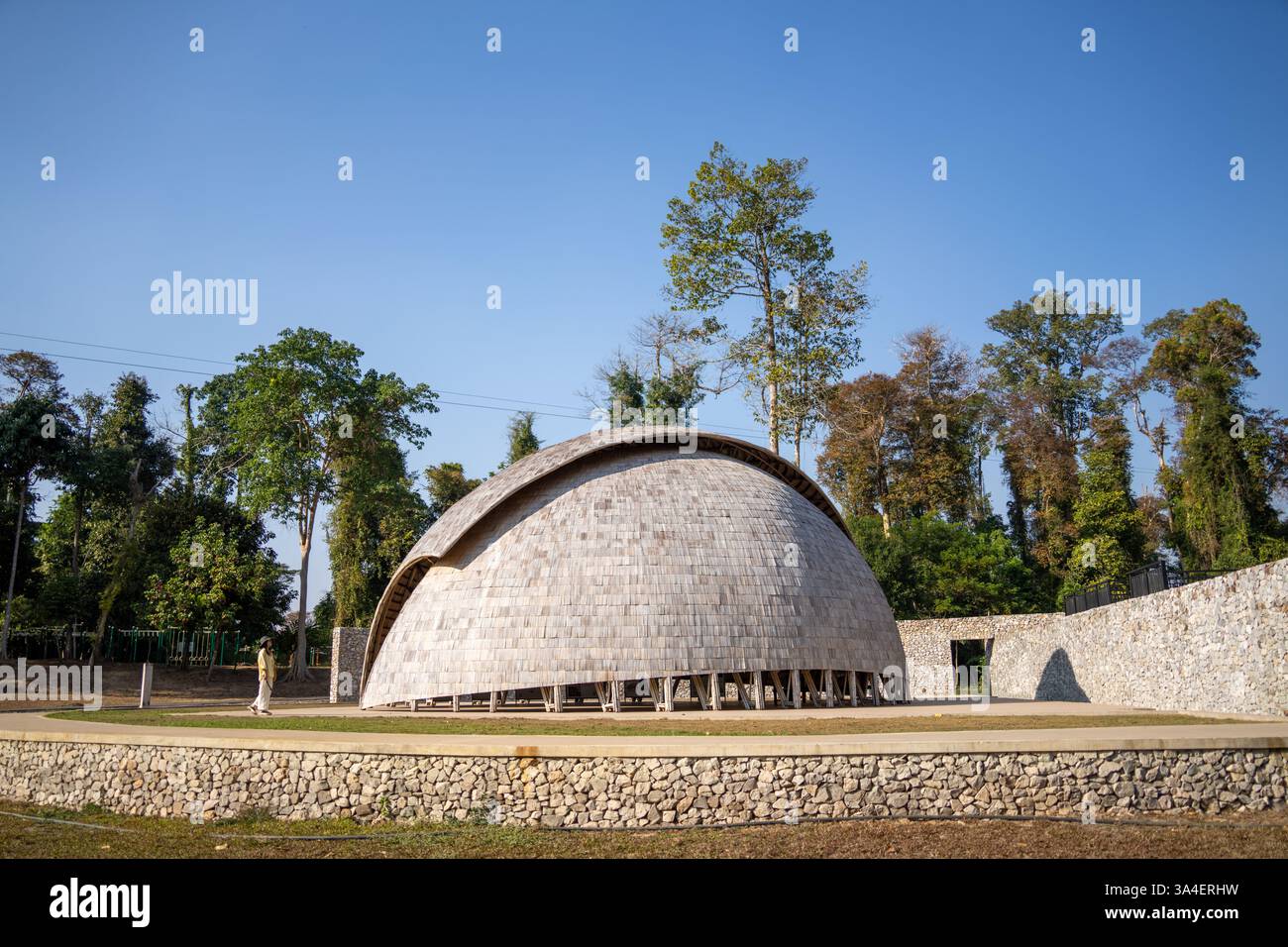 Stunning bamboo dome in Laos surrounded by lush greenery, an architectural marvel ideal for travel and landscape photography Stock Photo