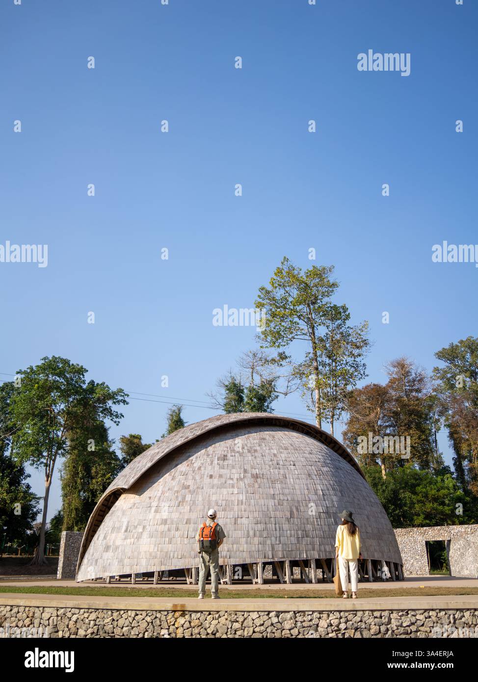 Stunning bamboo dome in Laos surrounded by lush greenery, an architectural marvel ideal for travel and landscape photography Stock Photo