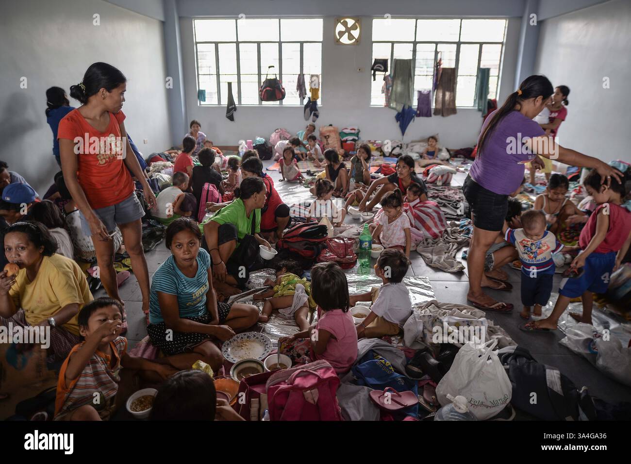 July 16, 2014 - Manila, Philippines - Filipinos occupy an evacuation ...