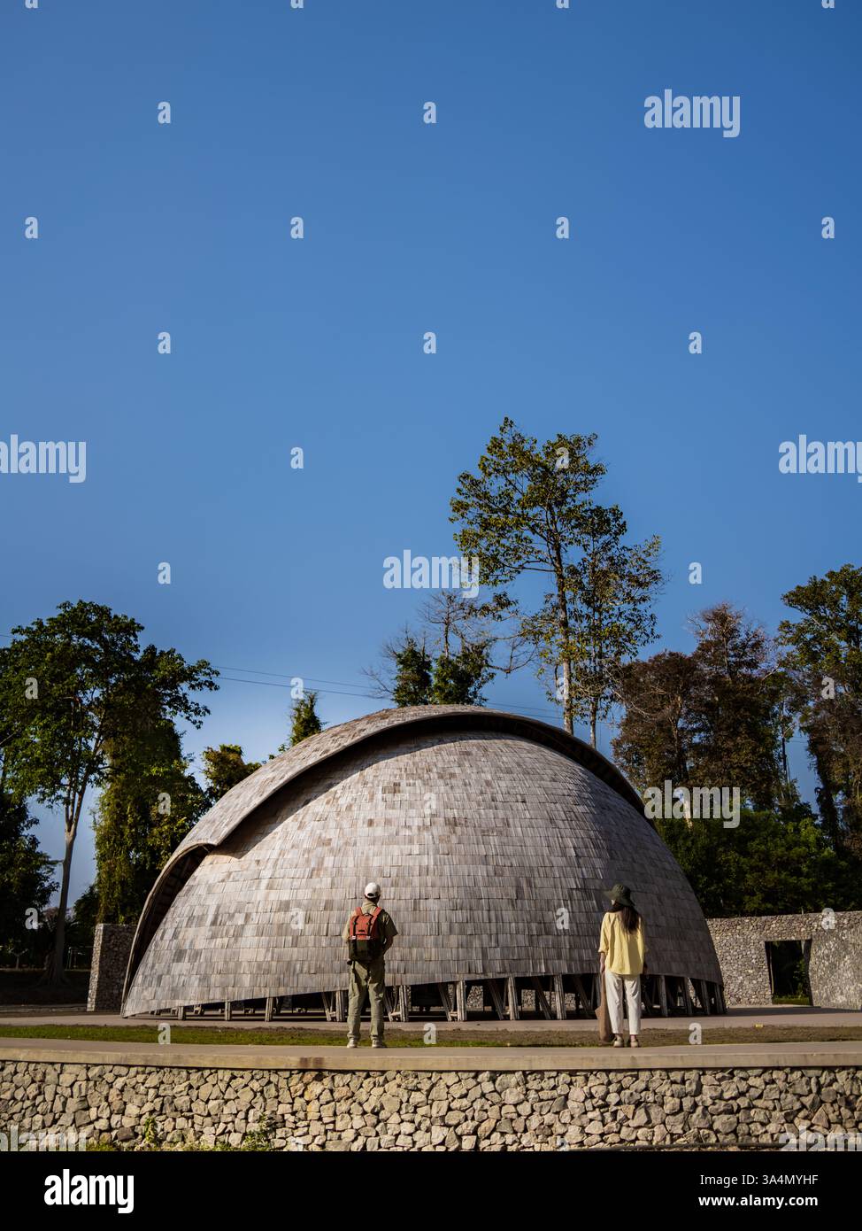 Stunning bamboo dome in Laos surrounded by lush greenery, an architectural marvel ideal for travel and landscape photography Stock Photo