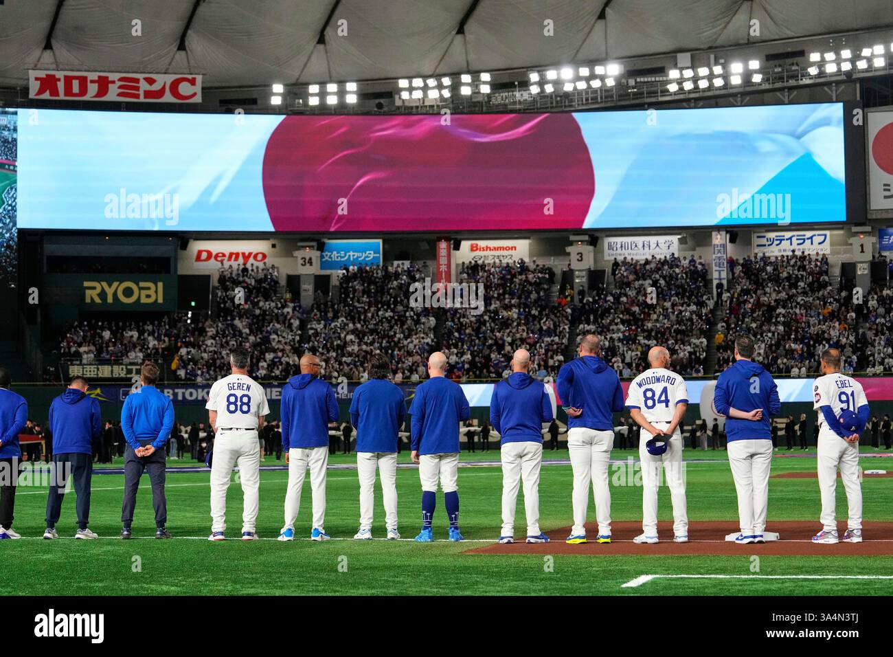 Members of the Los Angeles Dodgers line up on the field during team ...