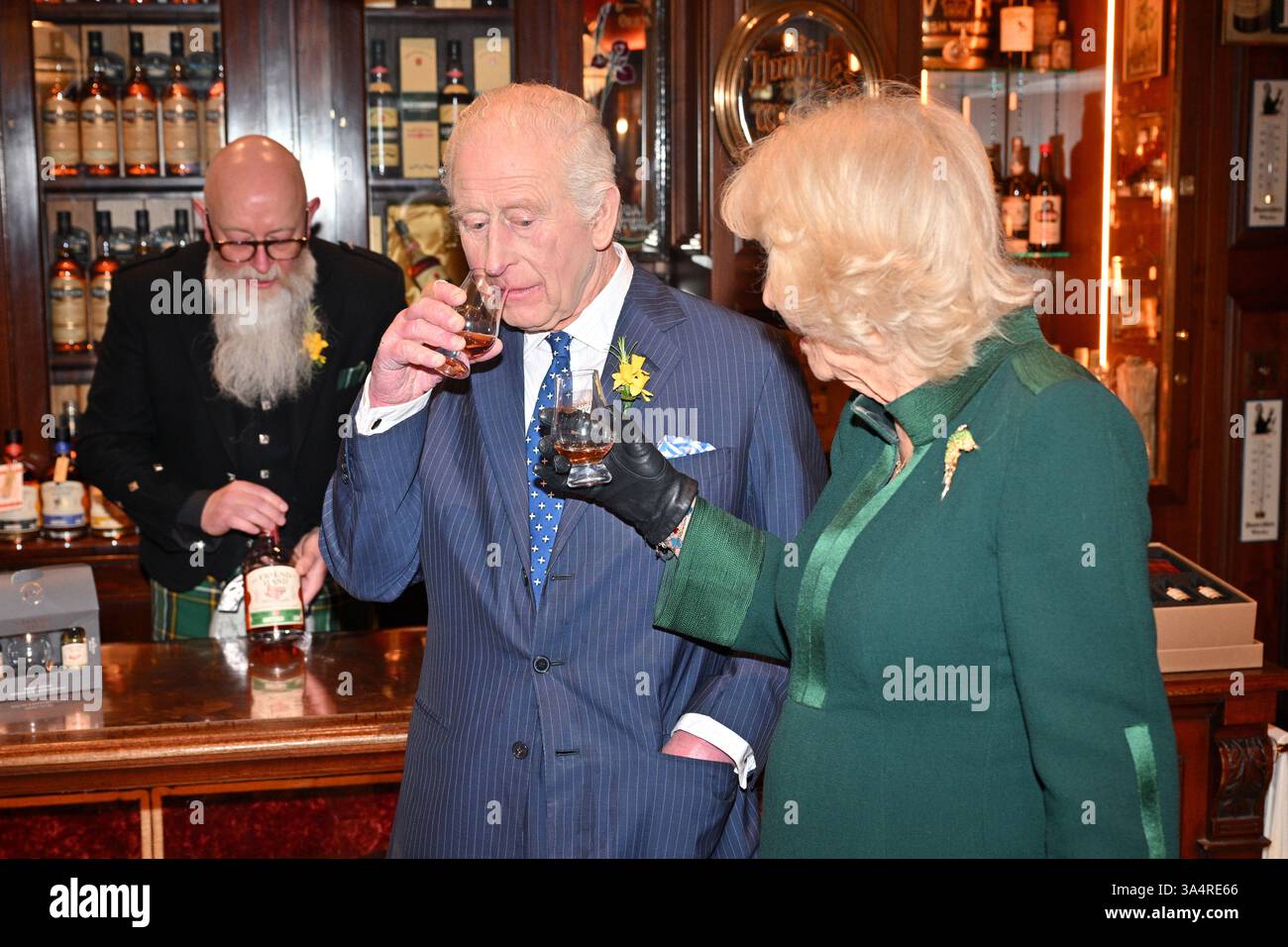 King Charles III and Queen Camilla taste whiskey at The Friend at Hand