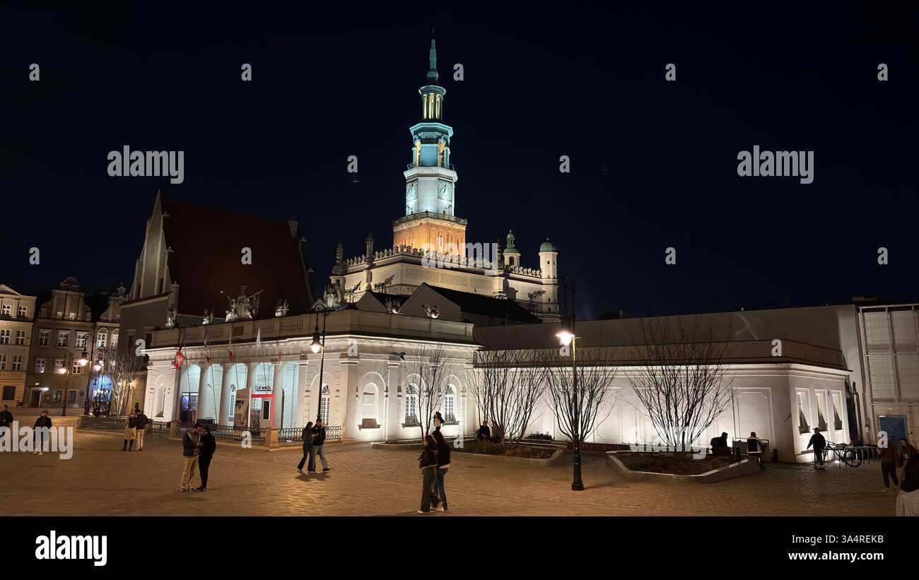Poznan city centre in the evening. At night darkness streets and buildings illuminated. Location in Poznań. Tourist destination place famous old build - Smartphone Captured Stock Image