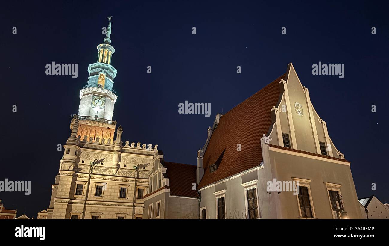 Poznan city centre in the evening. At night darkness streets and buildings illuminated. Location in Poznań. Tourist destination place famous old build - Smartphone Captured Stock Image