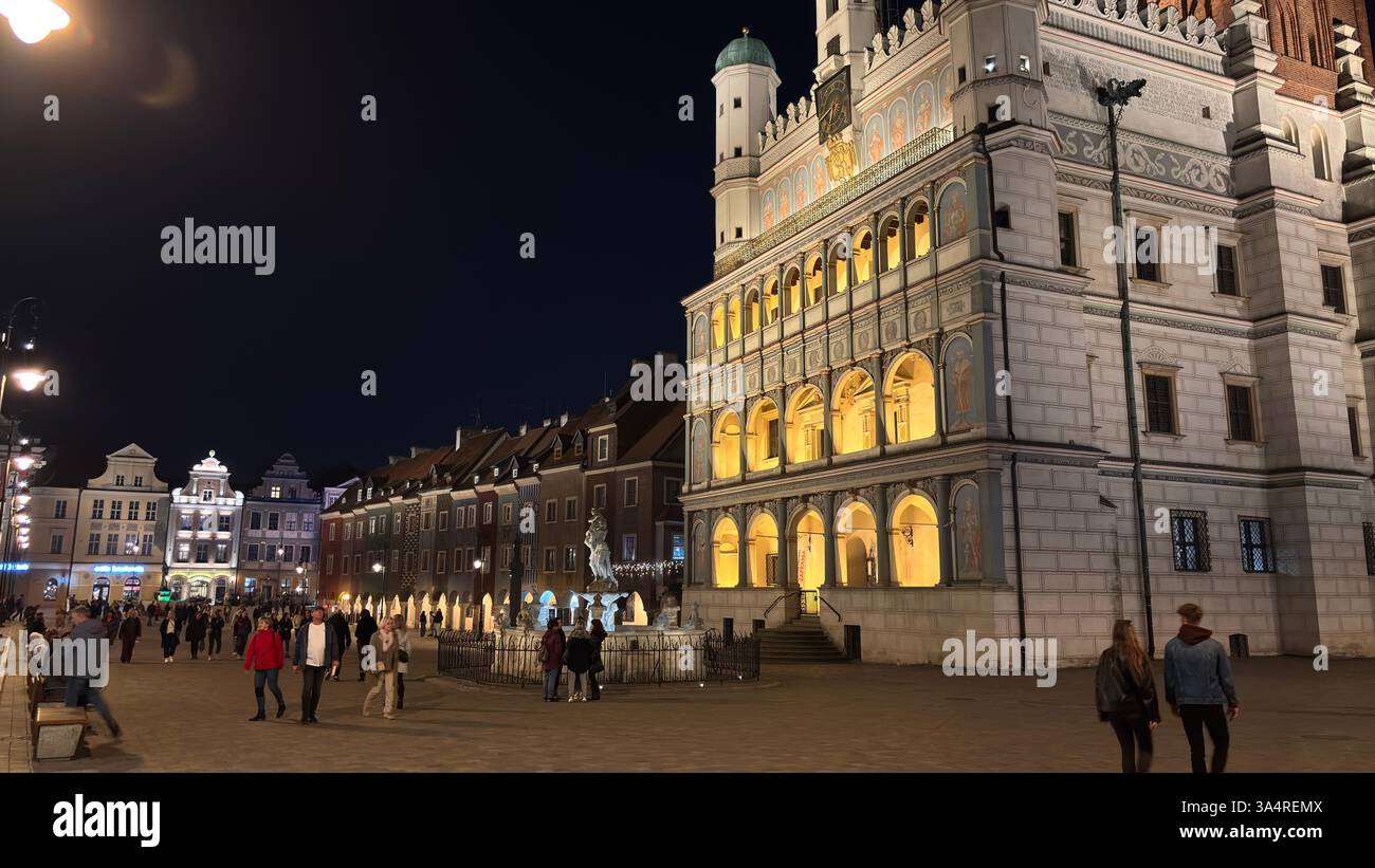 Poznan city centre in the evening. At night darkness streets and buildings illuminated. Location in Poznań. Tourist destination place famous old build - Smartphone Captured Stock Image