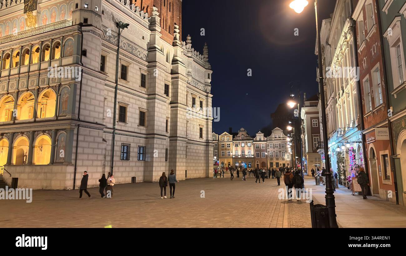 Poznan city centre in the evening. At night darkness streets and buildings illuminated. Location in Poznań. Tourist destination place famous old build - Smartphone Captured Stock Image
