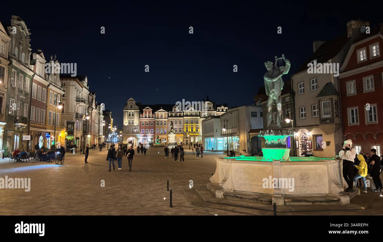 Poznan city centre in the evening. At night darkness streets and buildings illuminated. Location in Poznań. Tourist destination place famous old build - Smartphone Captured Stock Image