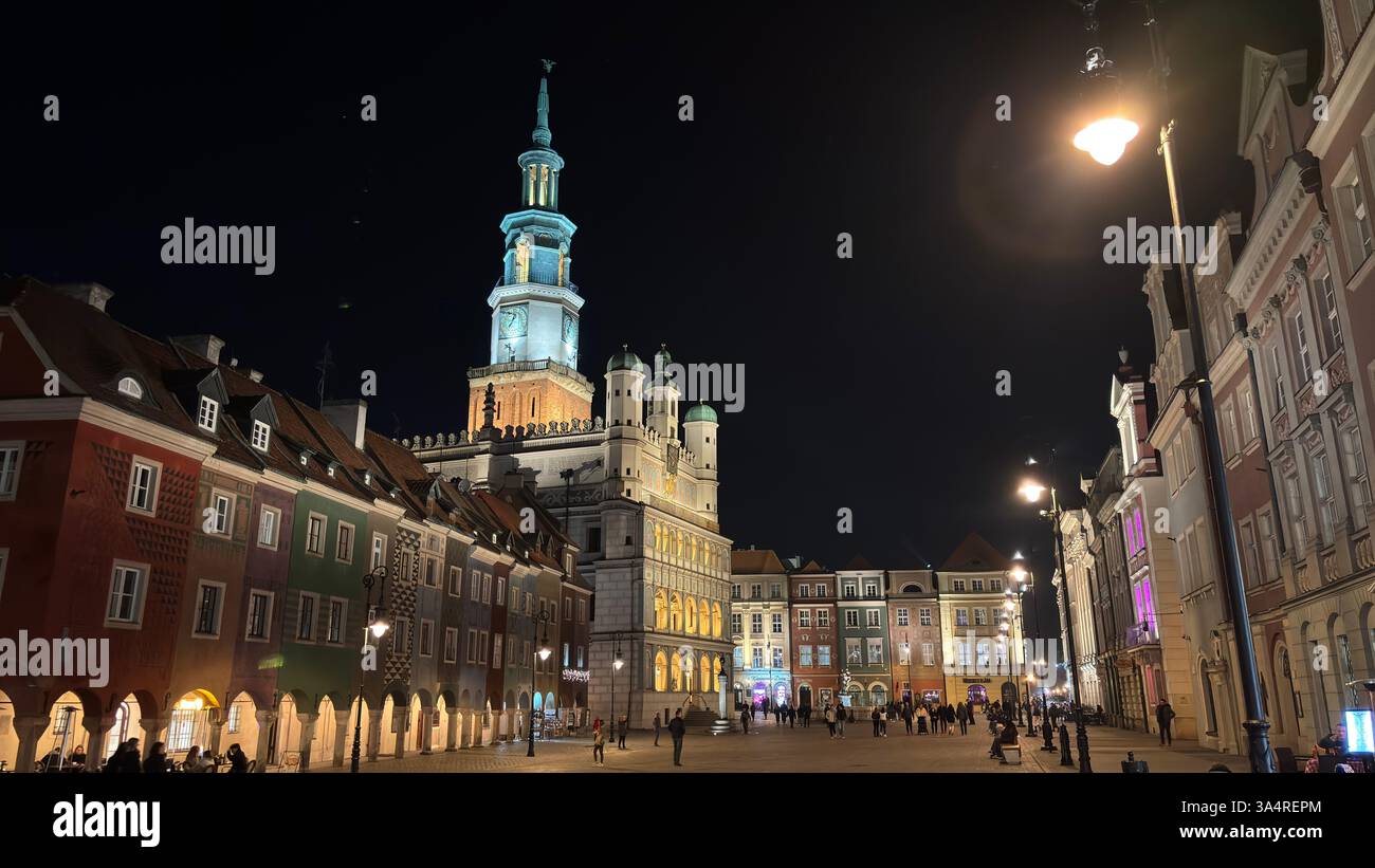 Poznan city centre in the evening. At night darkness streets and buildings illuminated. Location in Poznań. Tourist destination place famous old build - Smartphone Captured Stock Image
