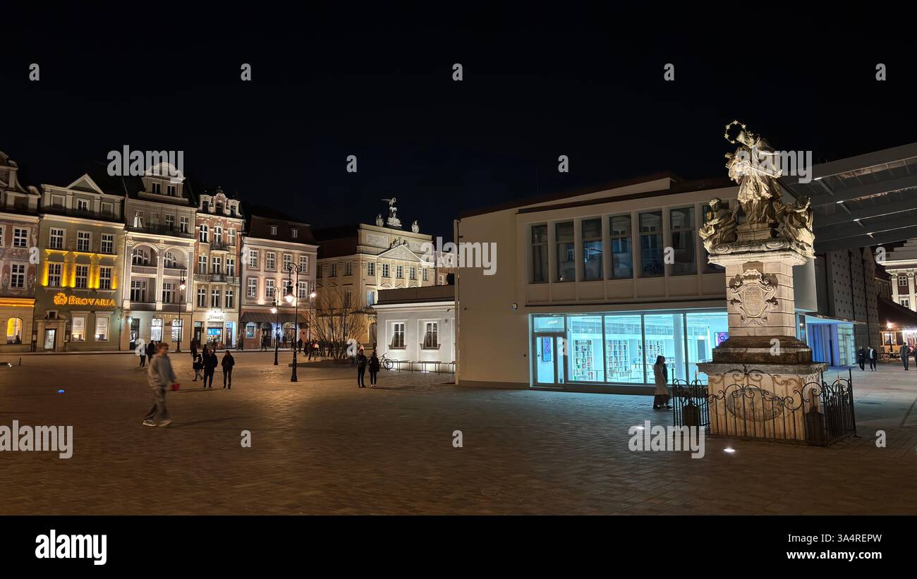 Poznan city centre in the evening. At night darkness streets and buildings illuminated. Location in Poznań. Tourist destination place famous old build - Smartphone Captured Stock Image