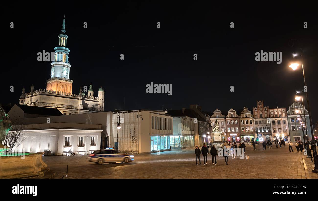 Poznan city centre in the evening. At night darkness streets and buildings illuminated. Location in Poznań. Tourist destination place famous old build - Smartphone Captured Stock Image