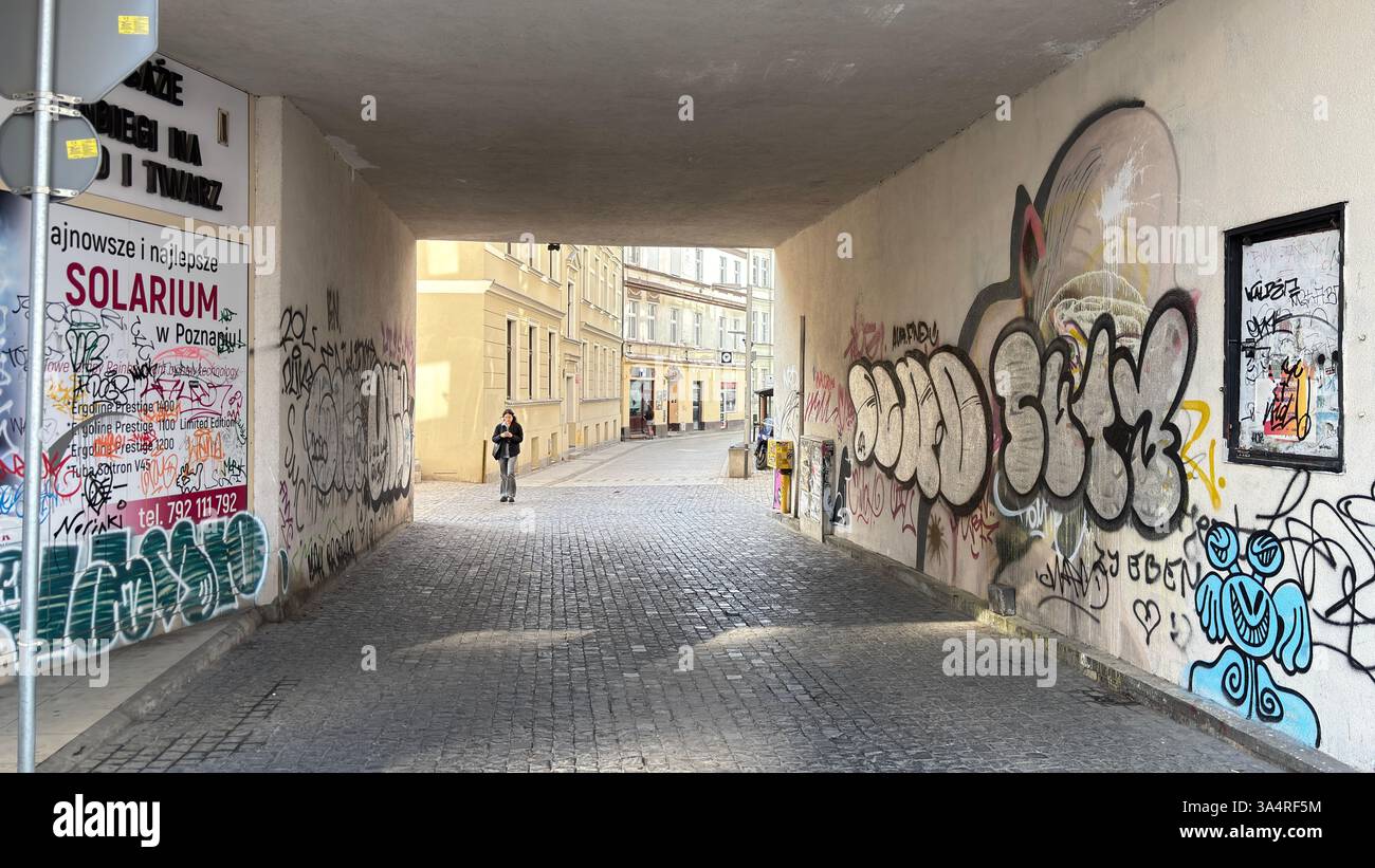 A road underpass pedestrian passage with graffiti in the Polish city of Poznań - Smartphone Captured Stock Image