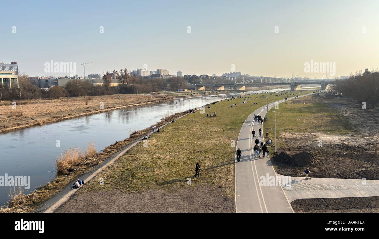 View across the Warta River in Poznan beside the Mosty Berdychowskie Bridge. Tourist destination location famous old buildings in Polski city centre - Smartphone Captured Stock Image