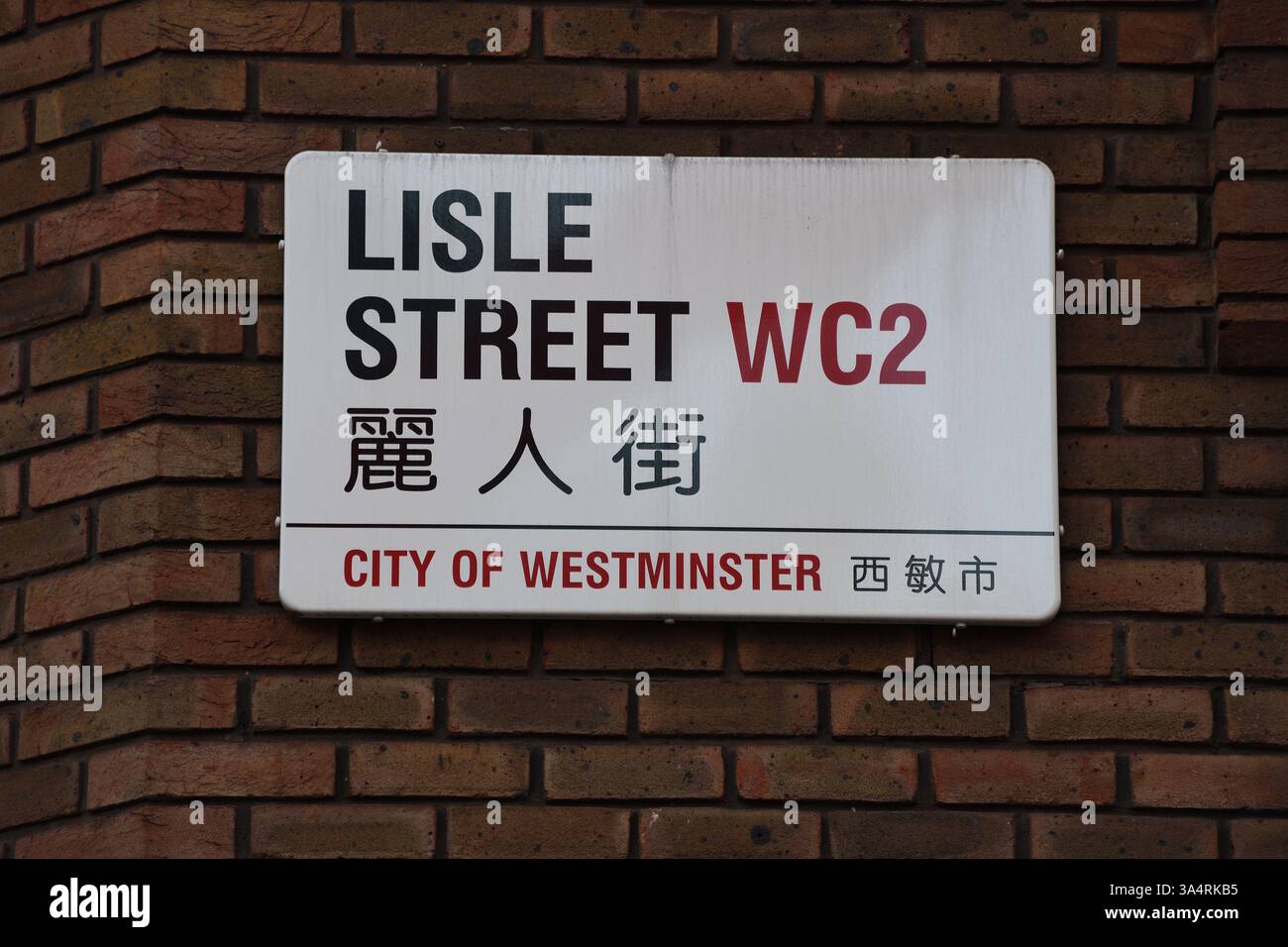 Bilingual street sign for Lisle Street, Chinatown,  City of Westminster, London, United Kingdom. Stock Photo