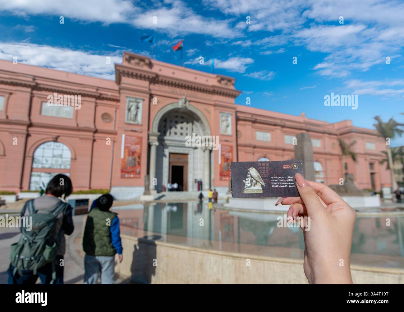 Cairo, Egypt - January 13, 2025: A visitor holds an Egyptian Museum ...