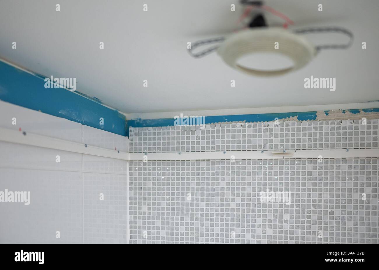 Replacing the stretch ceiling in the bathroom. Stock Photo
