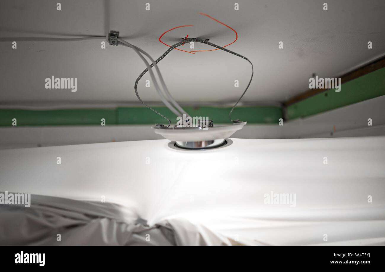 Replacing the stretch ceiling in the bathroom. Stock Photo