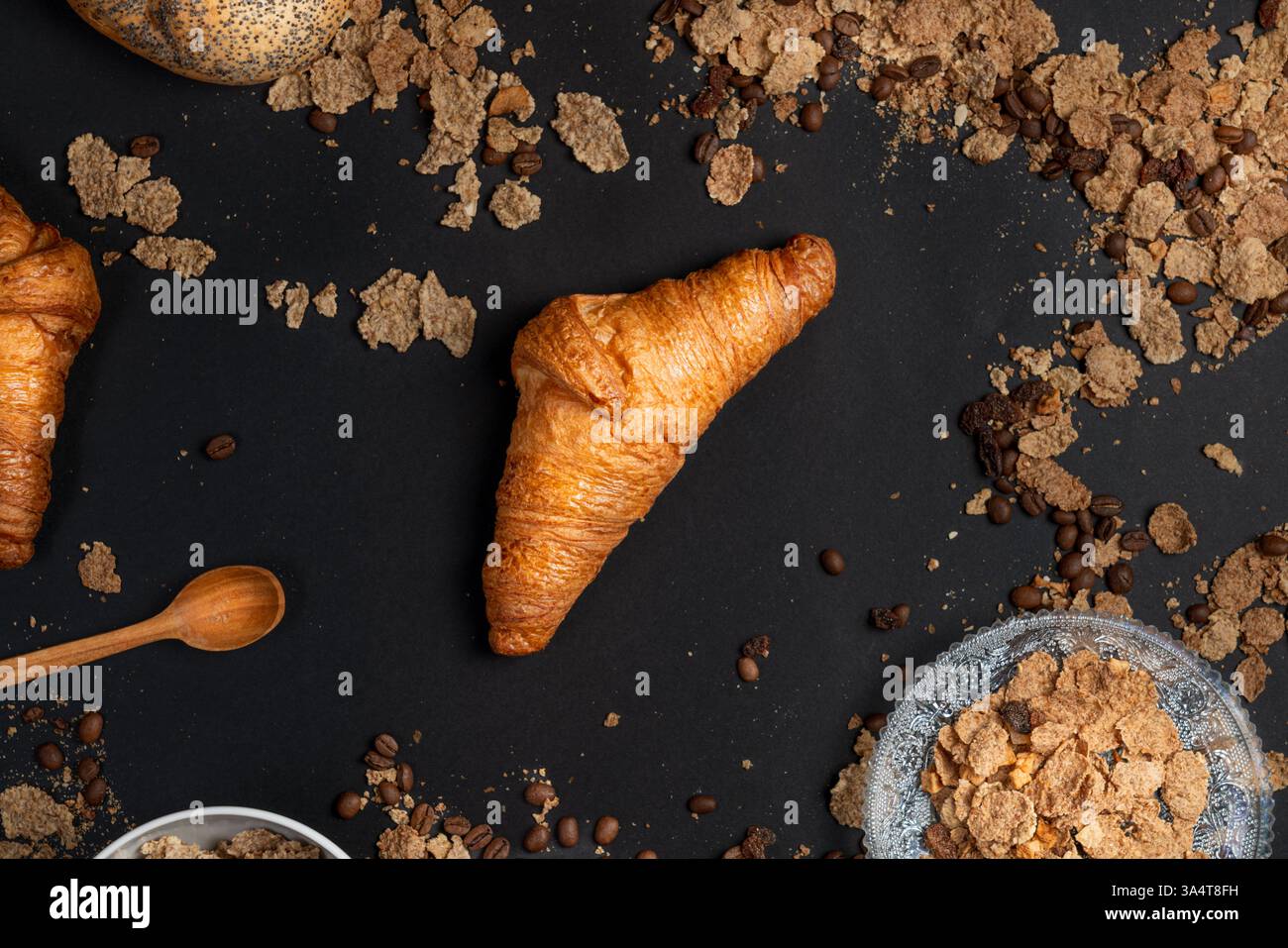 breakfast croissant oat meal coffee table dark background messy table copy space menu Stock Photo