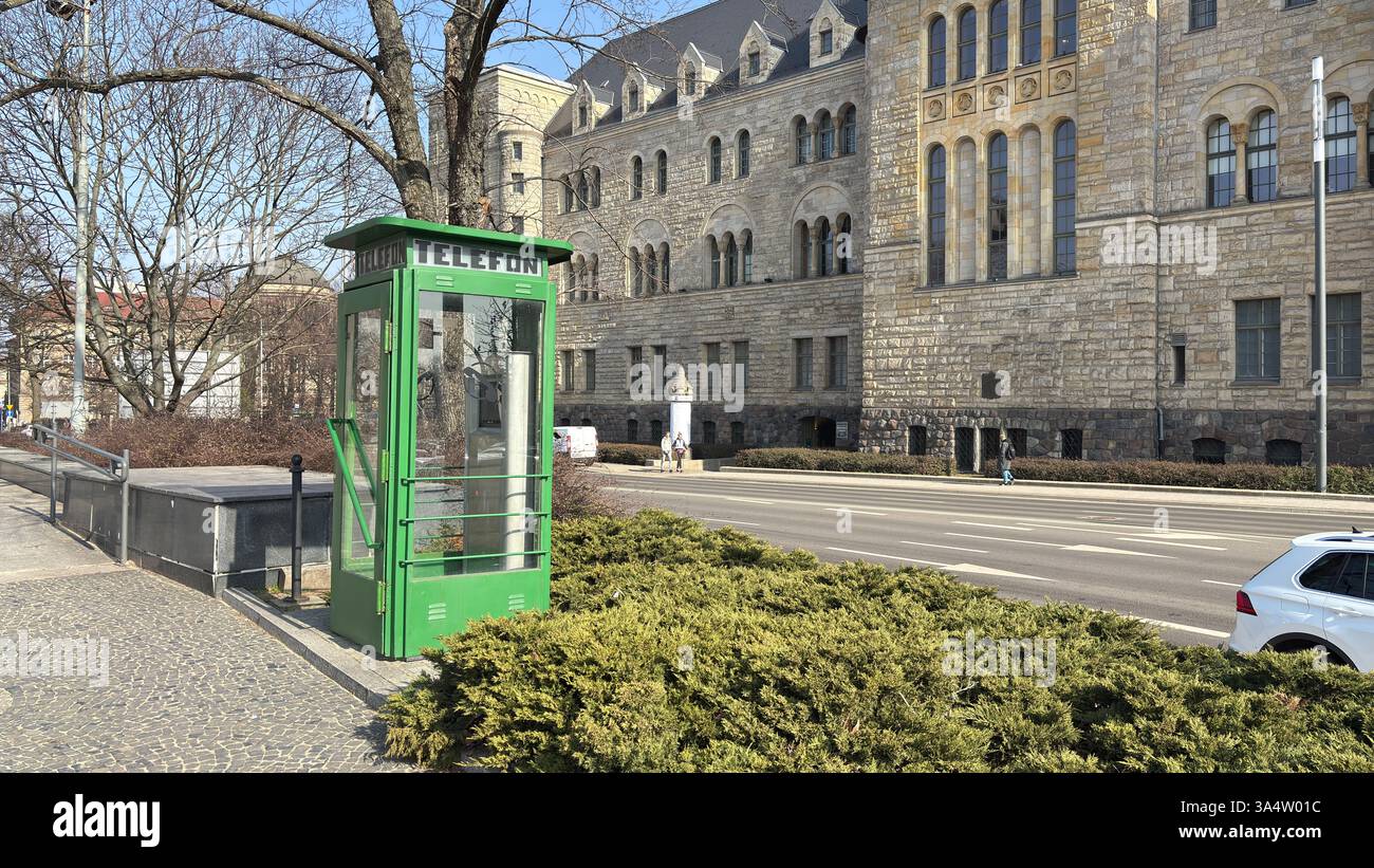 Old Soviet style phone box on the streets of the Polish city of Poznan. Tourist destination location famous old buildings in Polski city centre Poznań - Smartphone Captured Stock Image