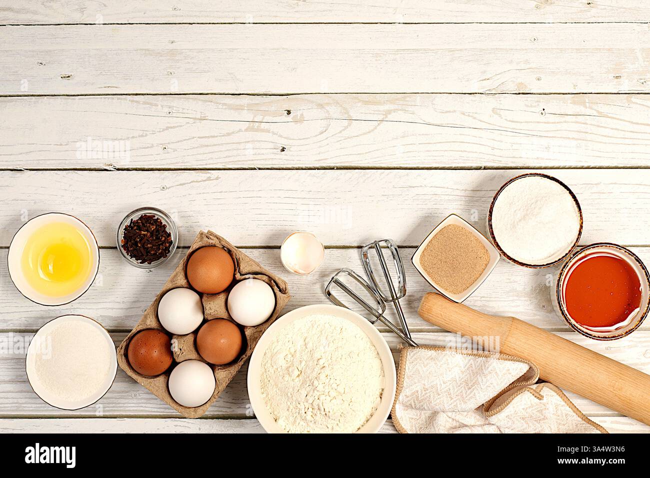 Recipe with eggs, flour, sugar, honey, cinnamon, yeast and butter. Kitchen background of cooking. Culinary ingredients for making pie and bread, Moder Stock Photo