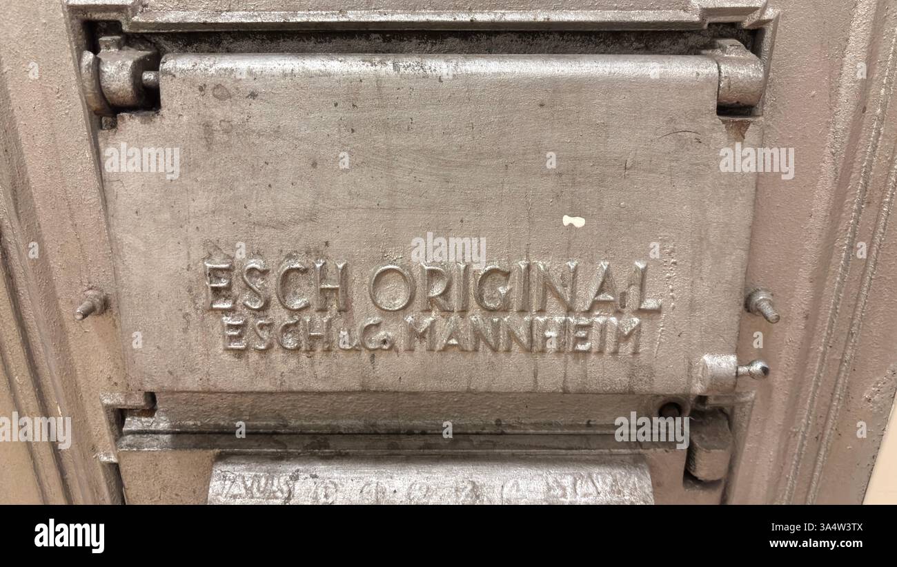 Vintage metal oven heater door. Cast iron made in Germany. Esch Original. Old retro style Industrial Revolution - Smartphone Captured Stock Image