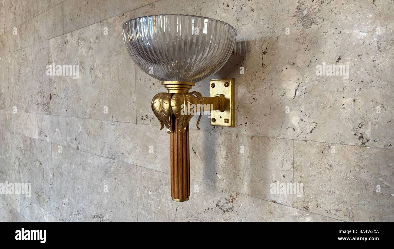 Retro 1940’s wall light fitting. Interior of Imperial Palace Castle in Poznan. Tourist destination location famous old buildings in Polish city centre - Smartphone Captured Stock Image