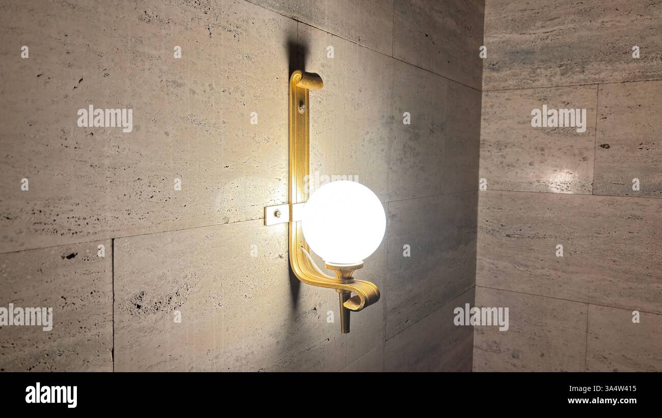 Retro 1940’s wall light fitting. Interior of Imperial Palace Castle in Poznan. Tourist destination location famous old buildings in Polish city centre - Smartphone Captured Stock Image