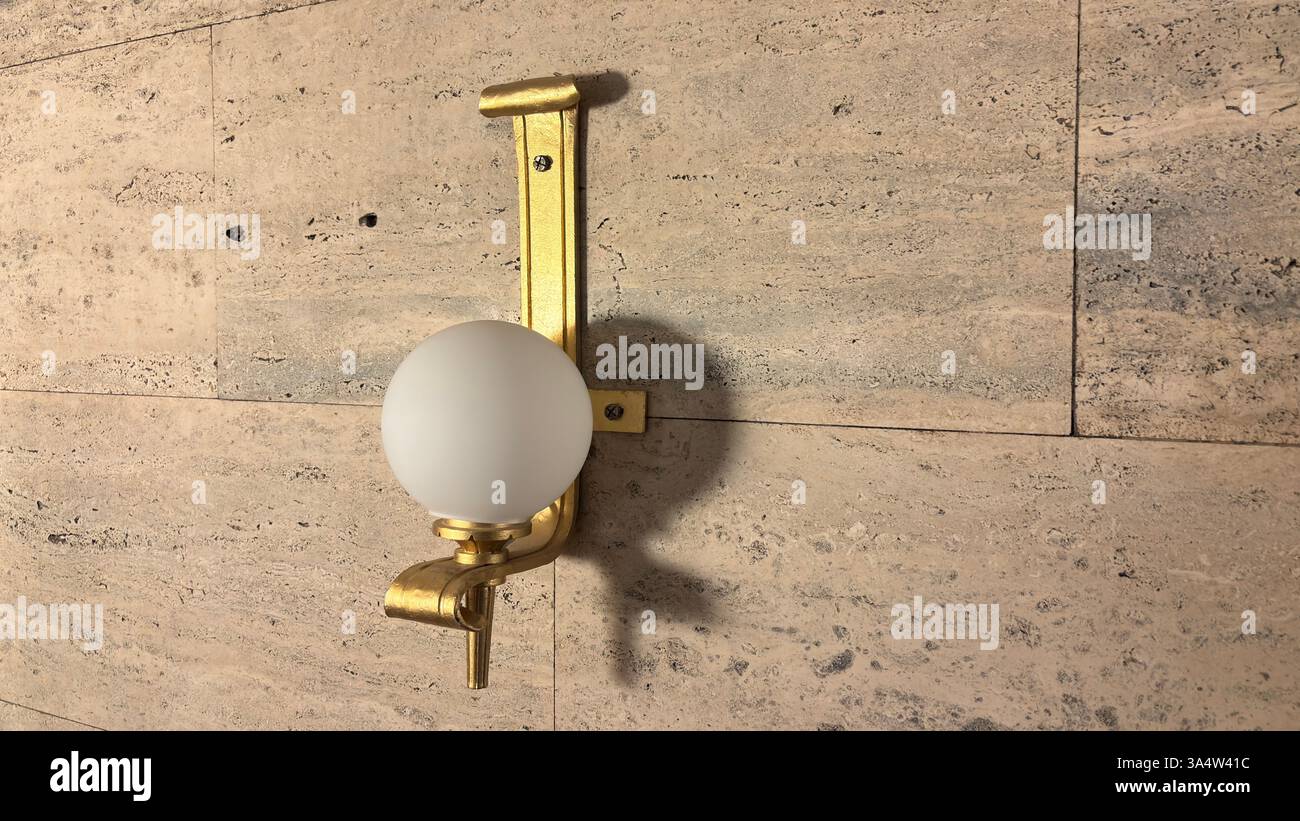 Retro 1940’s wall light fitting. Interior of Imperial Palace Castle in Poznan. Tourist destination location famous old buildings in Polish city centre - Smartphone Captured Stock Image