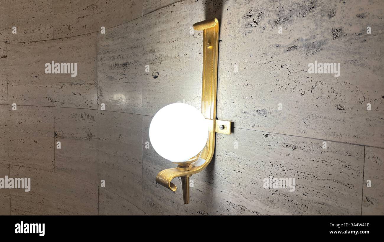 Retro 1940’s wall light fitting. Interior of Imperial Palace Castle in Poznan. Tourist destination location famous old buildings in Polish city centre - Smartphone Captured Stock Image