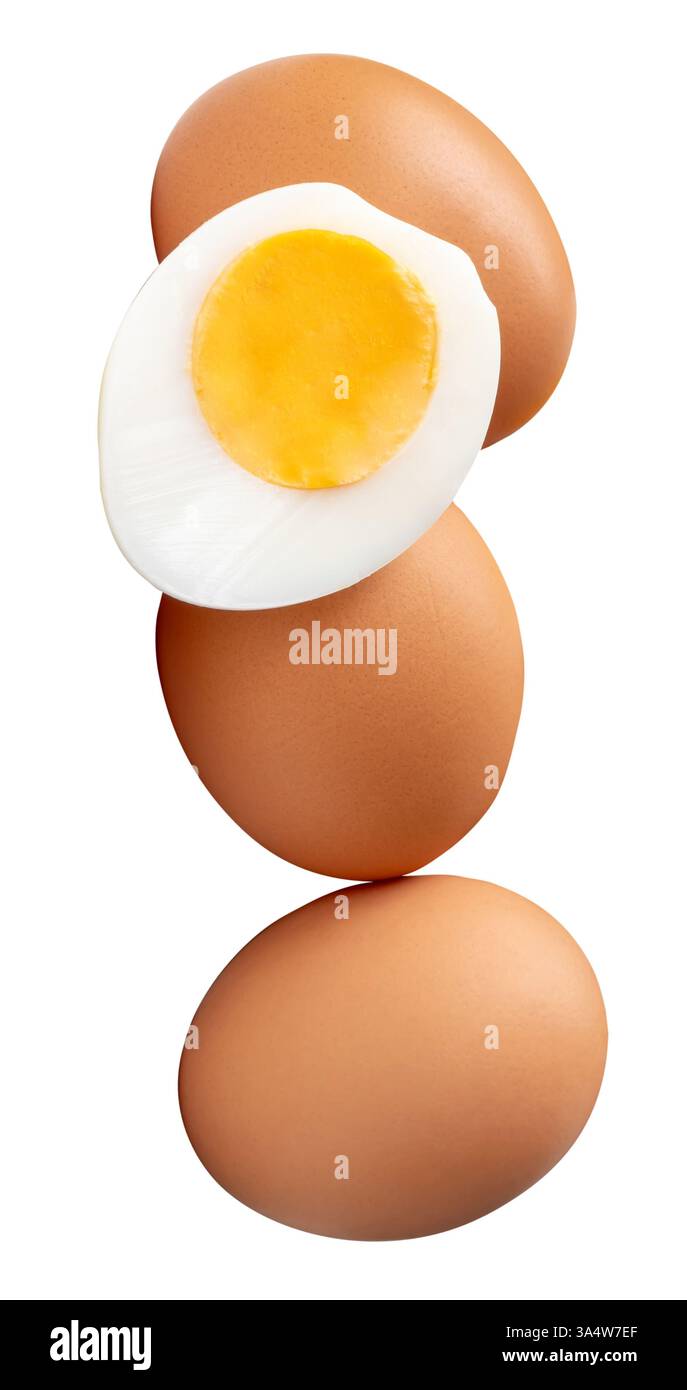 Front view or top view of raw brown chicken eggs and cooked or boiled chicken egg with egg yolk in half in pile or stack is isolated on white Stock Photo