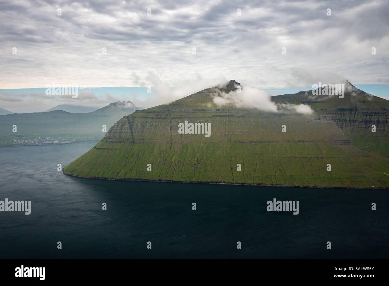 Stunning Aerial View Of Rugged Cliffs On Faroe Islands In Late Summer stunning-aerial-view-of-rugged-cliffs-on-faroe-islands-in-late-summer