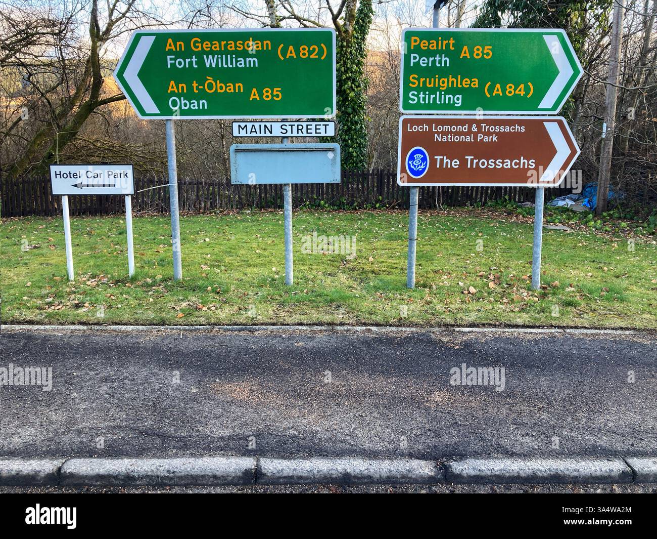Road junction with road signs at Crianlarich, for Fort William(A82), Oban(A85), Perth(A85), Stirling(A84) and The Trossachs, Scotland, UK - Smartphone Captured Stock Image