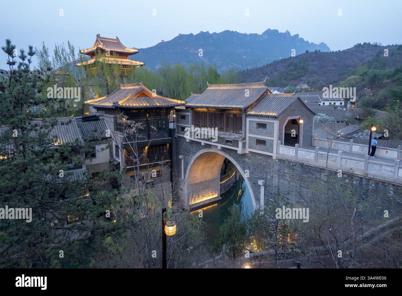 Canals run through the Gubei Water Town, north of Beijing, is nestled at the foot of the Simatai Great Wall. Stock Photo