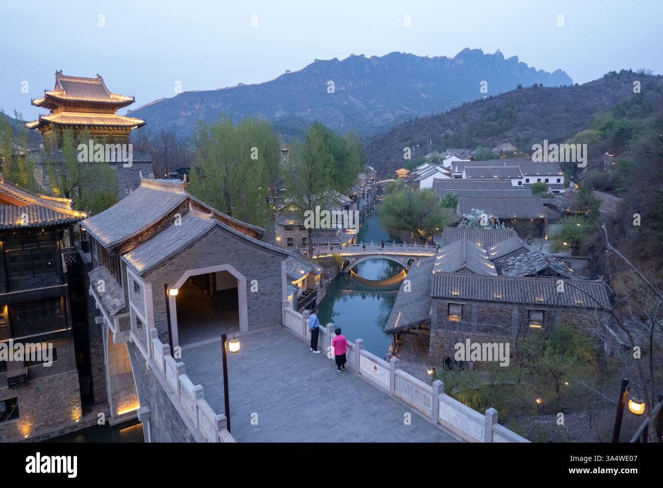 Canals run through the Gubei Water Town, north of Beijing, is nestled at the foot of the Simatai Great Wall. Stock Photo