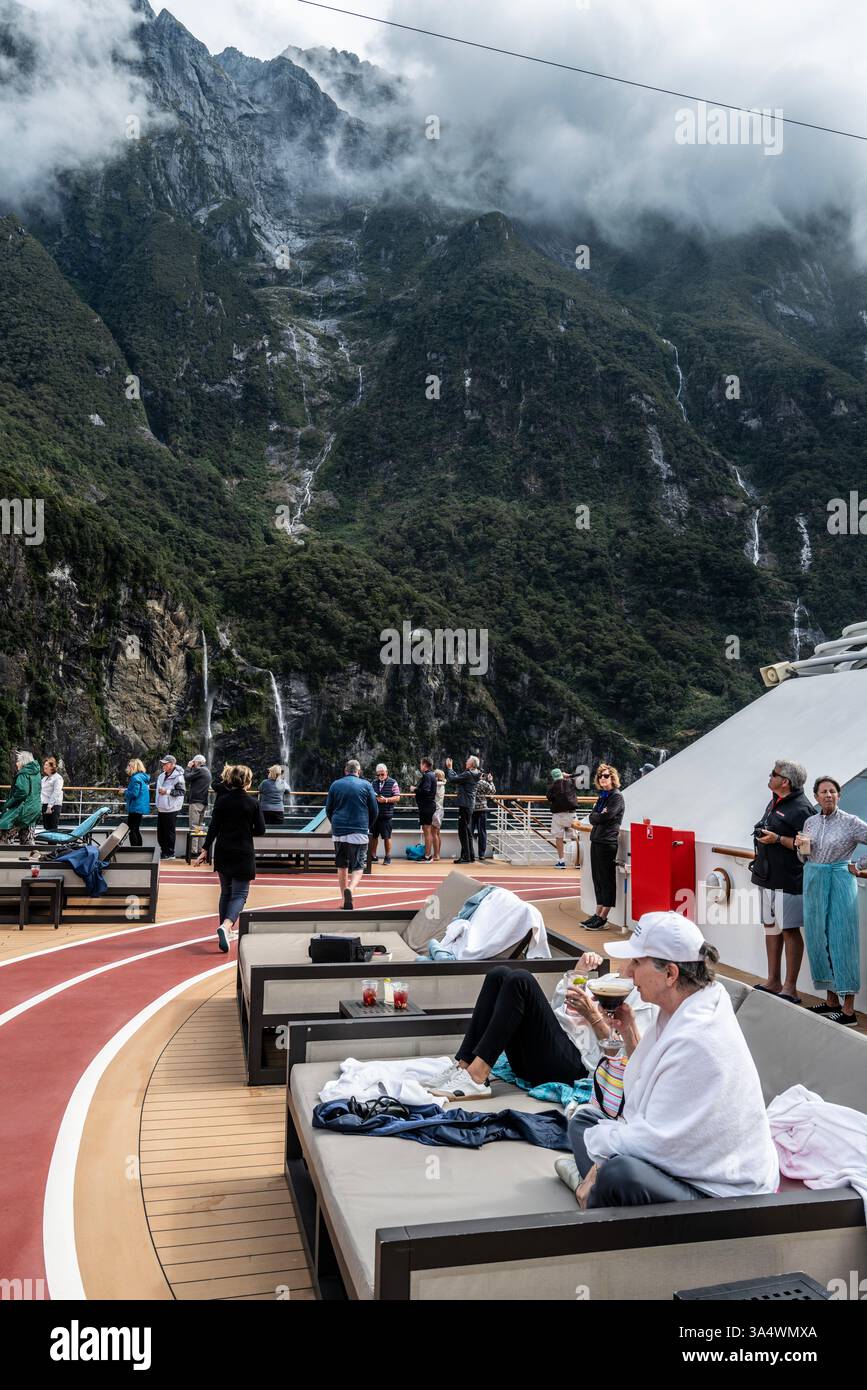 Silverseas cruise around New Zealand and Australia aboard Silver Muse. Silver Muse in the Milford Sound (Māori: Piopiotahi, officially gazetted as Mil Stock Photo