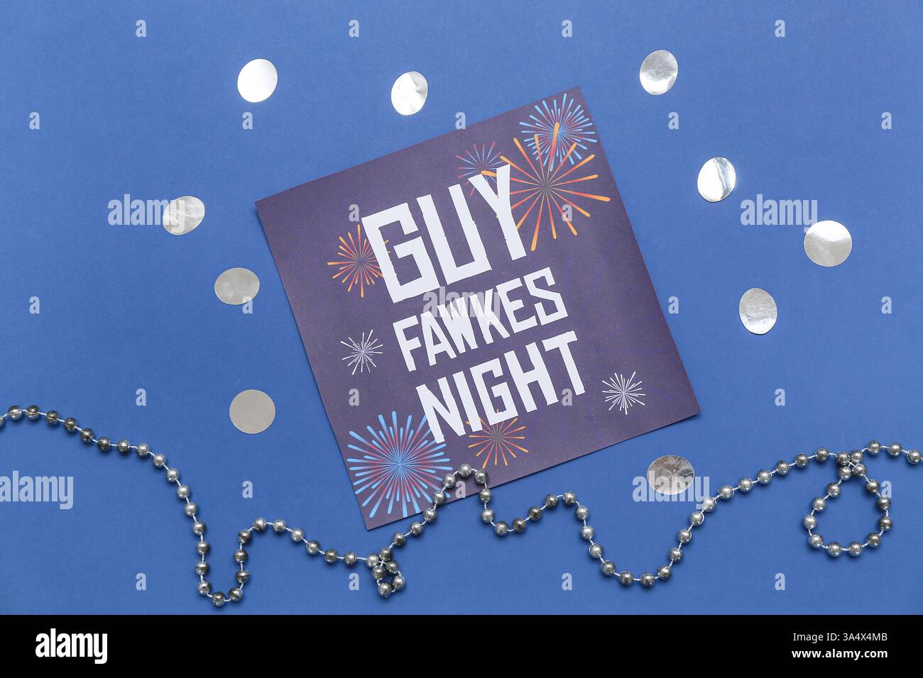 Greeting card for Guy Fawkes night with confetti and beads on blue ...