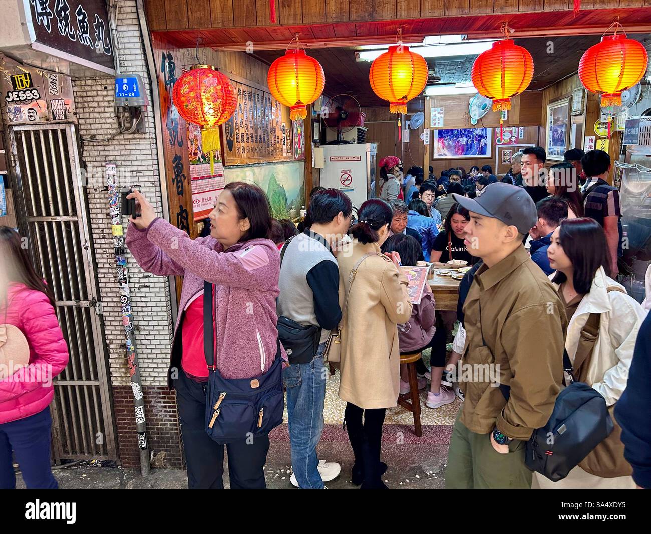 Jiufen, Taiwan, Large Crowd People, Tourists, inside Local Taiwanese Restaurant, Dining Room, Visiting Tourist Area, Old Town Street - Smartphone Captured Stock Image