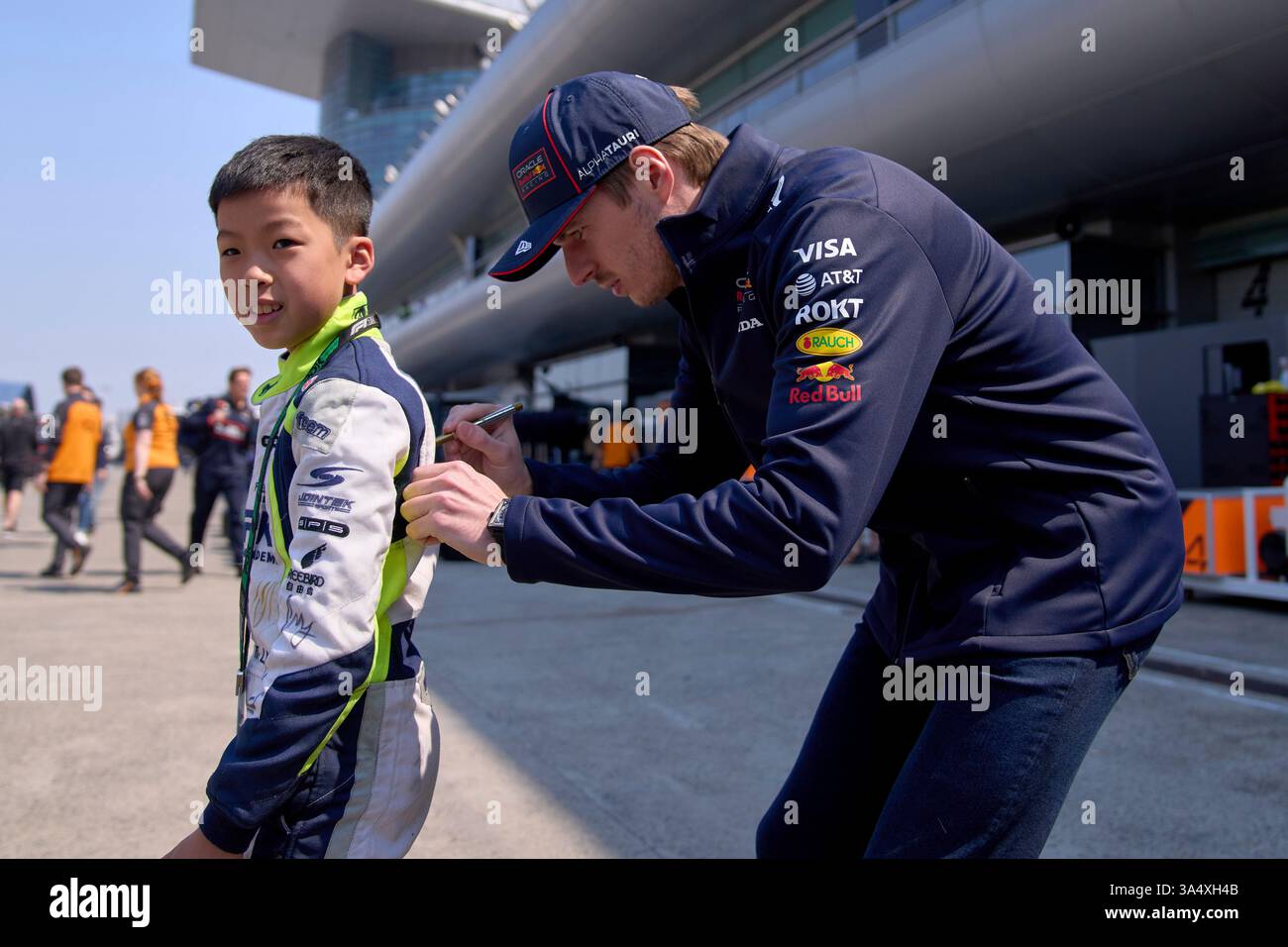 Red Bull driver Max Verstappen of the Netherlands signs his autograph ...