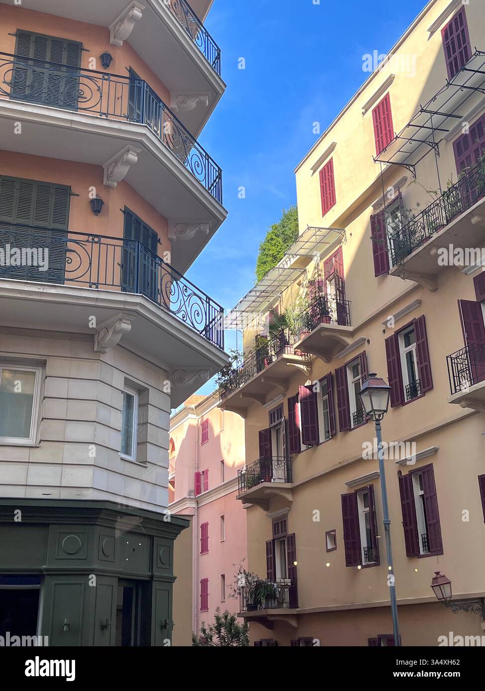 Charming Mediterranean architecture in the heart of Beirut, Lebanon, featuring elegant balconies, pastel facades, and sunlit streets. - Smartphone Captured Stock Image