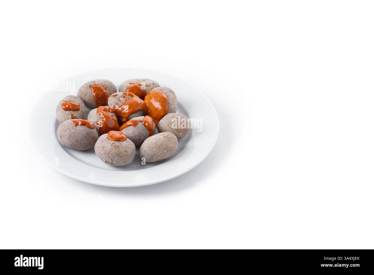 Papas arrugadas with mojo isolated on white background Stock Photo