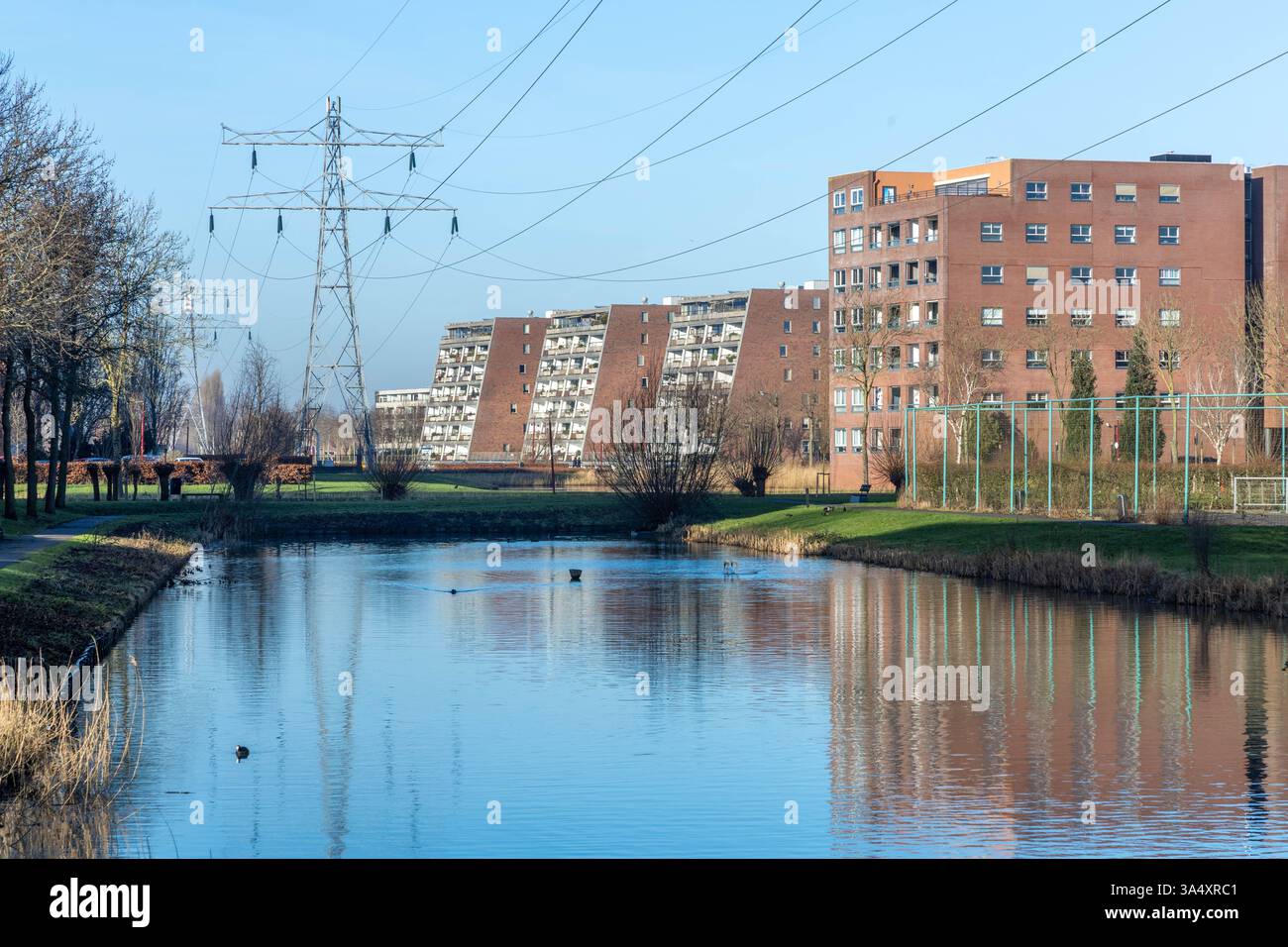 Electricity pylon in the middle of a residential area with family ...